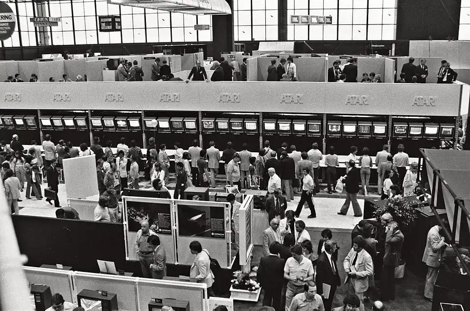 Atari at CES 1982. A line of CRT displays show Atari games to onlookers.