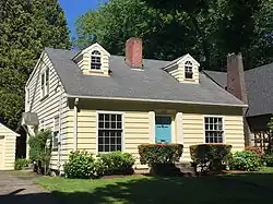 Cape Cod style home architecture. Note the windows in the roof.