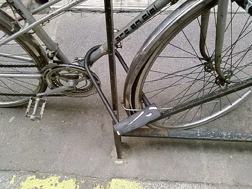 Lock both wheel and frame at once for best results.