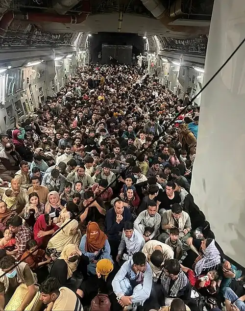 Evacuees aboard a C-17 plane.