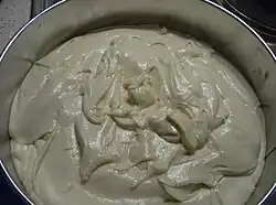 7. Pour the mixture into a greased and floured cake tin, then pop it in the oven