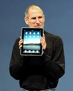 Steve Jobs introducing the iPad in 2010, one of the first popular tablet computers.