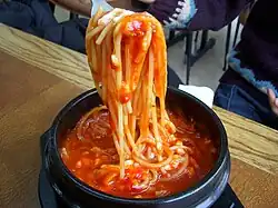 Korean-style spaghetti served in a ttukbaegi