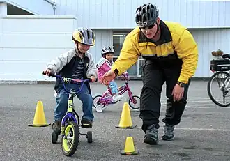 Cyclists leaning into a turn