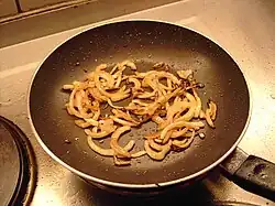 8. frying the onions in the meat juices