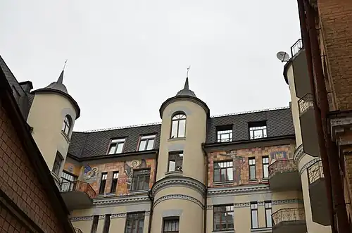 Decorative figures on the back side of the building at 8 Pankivska Street