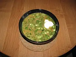 The soup is mixed and smetana is added.