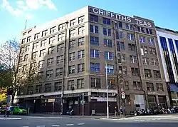 Griffiths Teas building in Sydney, view from the intersection of Wentworth Ave (left) and Hunt St (right). The facades facing these streets form an obtuse angle. (May 2014)