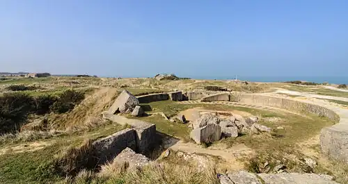 Part of the modern day site, with the remains of a gun pit in the foreground.