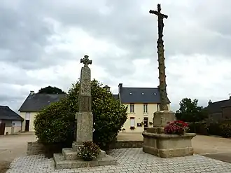 The calvary, the war memorial and the town hall in Bolazec