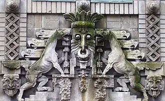 Ornamentation over the entrance to 130 East 25th Street (1915-16), originally an office building, now an AIDS hostel[12]