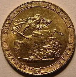 A gold coin showing as its central element St George on horseback attacking a dragon using a broken spear