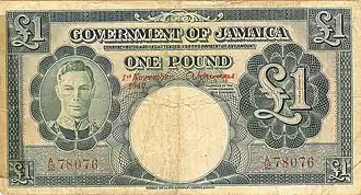 Dark blue coloured banknote showing image of George VI