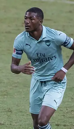 A colour photograph of Ainsley Maitland-Niles, in action for Arsenal.