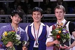 The men's event medalists at the 2012 Rostelecom Cup