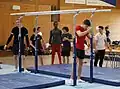 Preparation of the parallel bars during podium training by Team Belgium