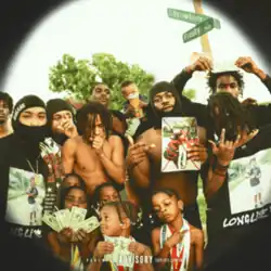Several men and children posing for the camera and holding various objects including dollar bills underneath a street sign.