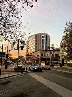 Corner of 4th and Broadway at dusk, the building can be seen in the background