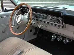 Interior image of a 1967 Ford Ranchero with bench seat and three-speed shifter on the steering column