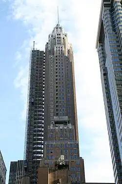The facade of 70 Pine Street in 2014, covered in scaffolding during a renovation