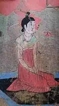 A Tang dynasty Woman wearing a green, U-shaped collar banbi.