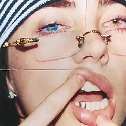 Photo of Billie Eilish with different colored eyes, likely to represent the song's two sections
