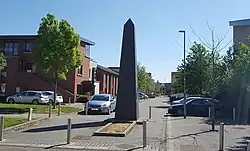 Housing and obelisk (installed in 2009) at Adamstown