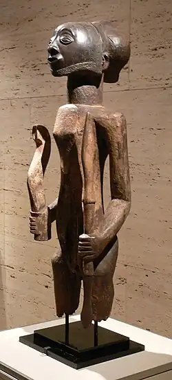 Warrior ancestor figure; 19th century; wood; 84.1 cm × 26 cm × 23.2 cm (33.1 in × 10.2 in × 9.1 in); by Hemba people; Kimbell Art Museum (Fort Worth, Texas, USA)