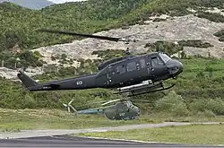 An Albanian AB-205A1 (front) with a Z-5 helicopter (behind)