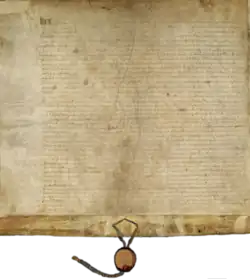 A piece of rectangular parchment with a ribbon and seal hanging from the bottom.