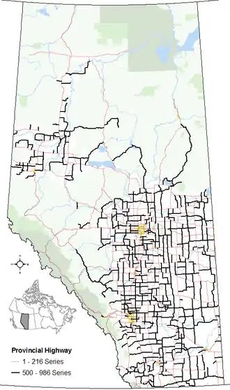 The alignments of the 500–986 series of highways within Alberta's provincial highway system within other base features including hydrography, national/provincial parks, cities and city equivalents, and the provincial green and white zones.