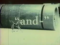 The film's title frame shows a large metal cylinder ominously rolling towards a glass figurine of a horse.