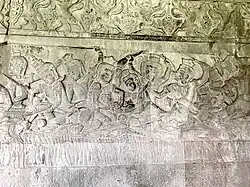 The bas-relief of deep massage abortion located in the Heaven and Hell Gallery of Angkor Wat. The operator is a demon rather than a traditional birth attendant. The pregnant woman’s abdomen is darkened from being touched by visitors. The bas-relief dates from about A.D. 1150.