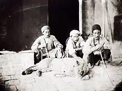 Men with a live lion in Persia, photographed by Antoin Sevruguin (1830s–1933)