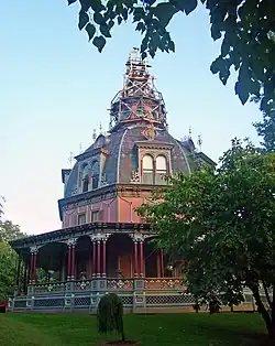 Large ornate house, with a level of decoration more usually associated with public buildings. Originally more modest in conception, the house was built in 1860 and the dome was added during 1872–1876. Armour–Stiner House, Irvington, New York.[4]
