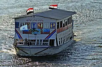 The governorate flag on the bow of the Arous El-Nile ship in Desouk city.