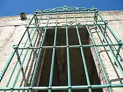 Wrought iron grill on window