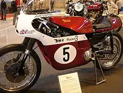 Red-and-white racing motorcycle in museum