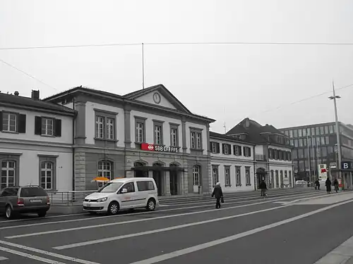 Two-story station building with multiple rooflines