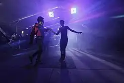 Photo of two people dancing at baile sonidero in Martín Carrera, Mexico City.