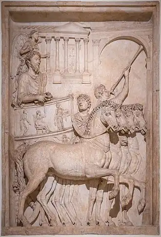 Tuba player (upper right) in a relief in Rome's Palazzo dei Conservatori depicting Marcus Aurelius in triumph