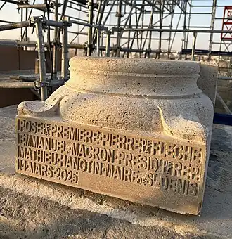 First stone of the reconstruction of the spire (2025)