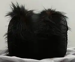 Black muff with fur trim