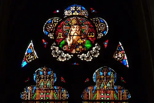 Top of central window in the axis chapel - "Alpha and Omega"