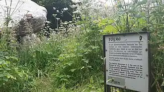 OPW notice (Irish: Fógra) at the national monument