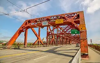 Front portion of a red-colored steel bridge