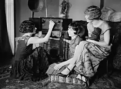 Image 42Around 1920, radio broadcasting started to get popular. The Brox Sisters, a popular singing group, gathered around the radio at the time. (from History of radio)