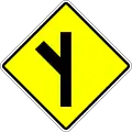 Skewed side road junction on the left