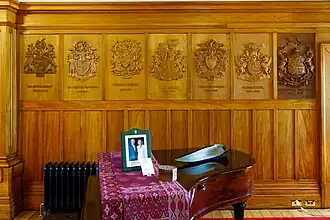 Carved armorial bearings on the walls of the Taupaepae in Government House