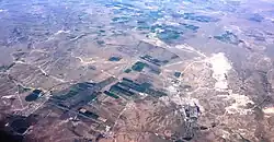 Aerial view over central parts of the county, with agriculture and Guangmingcun open-pit mine.